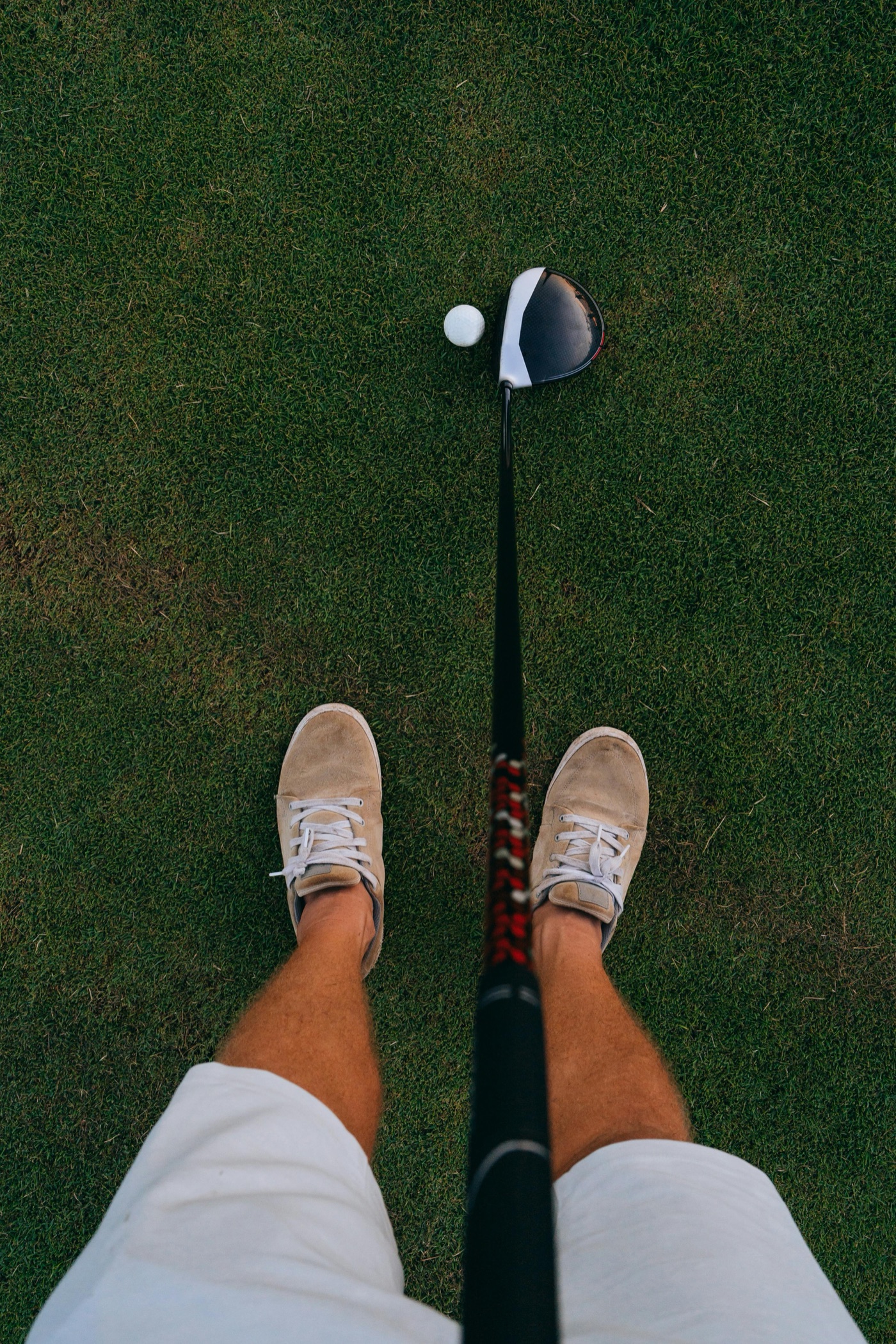 Mid-swing on a valley fairway